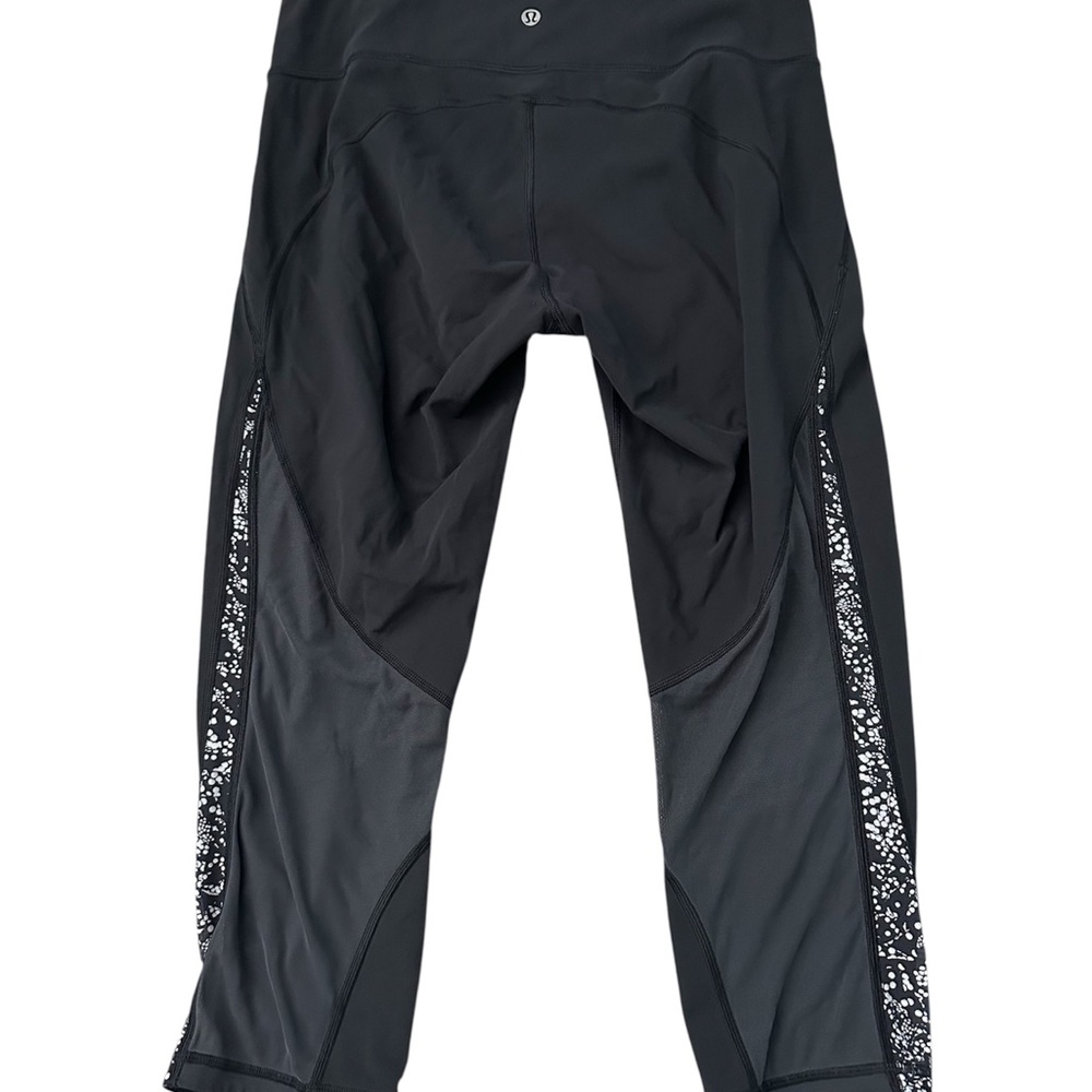 Leggings with Patterned Sides. See through mesh at back of legs. 21 inseam.